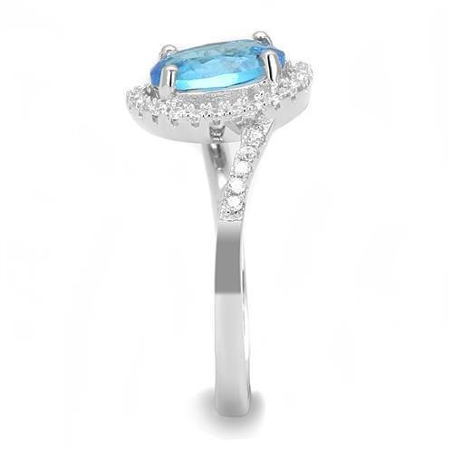 The Sky Bloom Ring – Oval Light Blue Spinel with Asymmetric Halo Loop & Floral Accent in Polished Rhodium-Plated Sterling Silver Lysandra Luxe