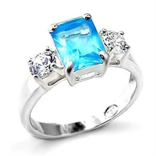 The Sea Serenade Ring – Emerald-Cut Sea Blue Spinel with Clear Side Stones in Polished 925 Sterling Silver Lysandra Luxe